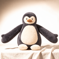 Weighted Penguin charcoal and cream hug companion on linen